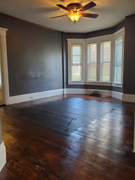 Large living room before new flooring - 57 Cartier St