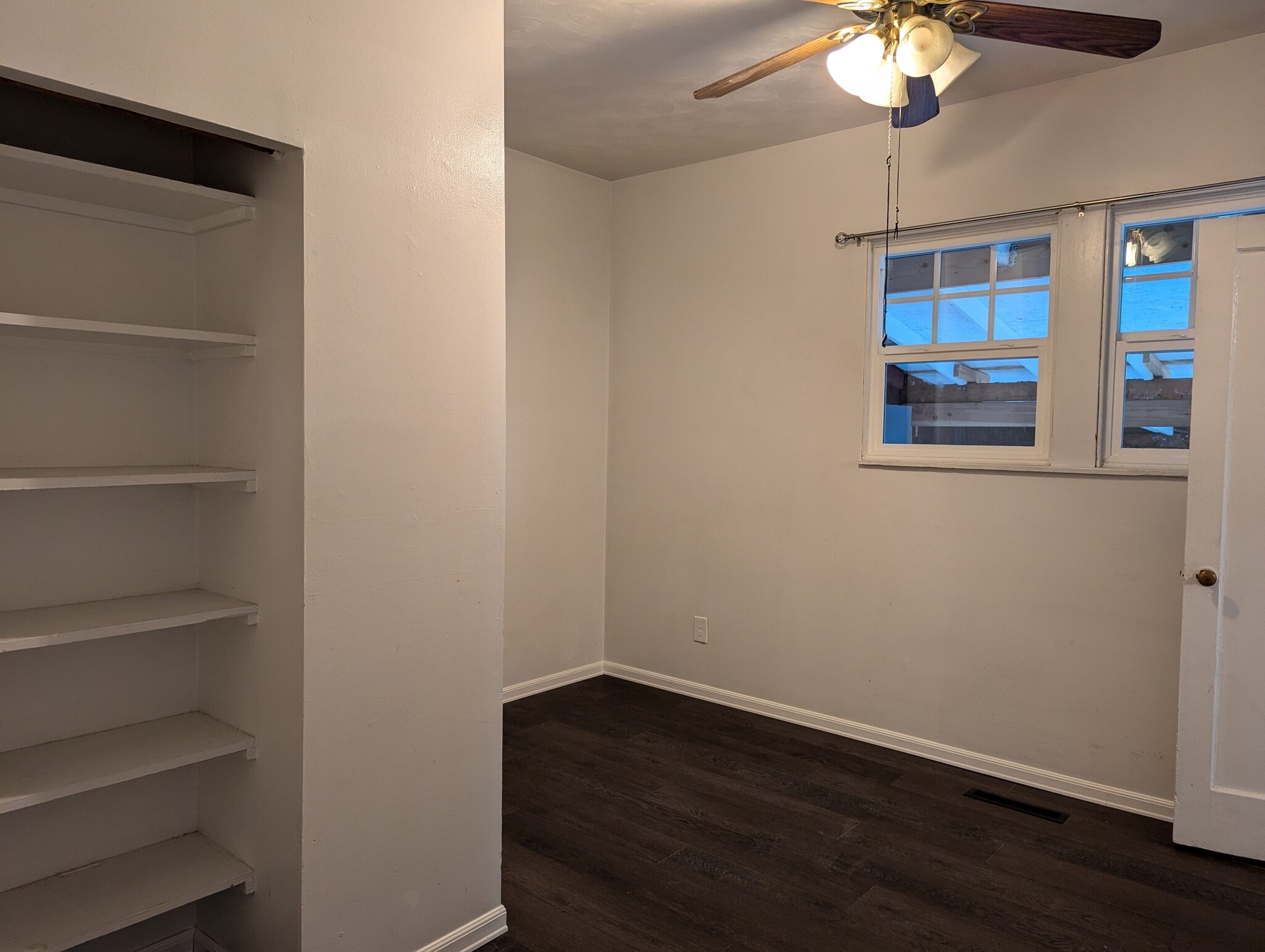 Back bedroom with ceiling fan - 9505 E Broadway Ave