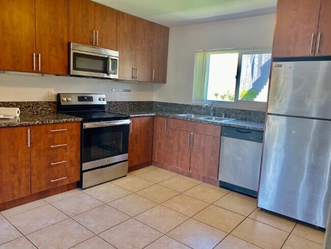 Kitchen with stainless steel appliances - 5040 A St #10