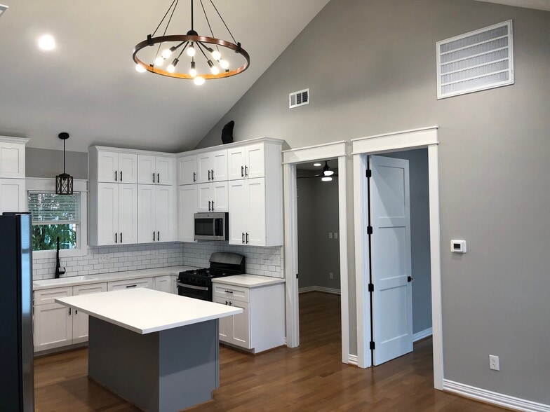 view from the office nook looking back at both bedroom doors and kitchen - 1928 Harold St