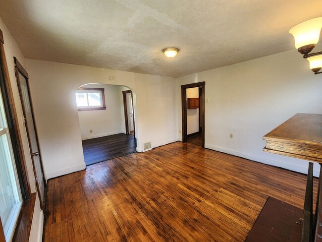 Building Photo - 4 BR home with first-floor living, new roof, and a private-feeling backyard in Lincoln Place