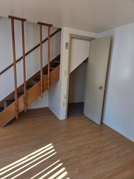 Storage closet under the steps in the living room - 496 Mercer Rd
