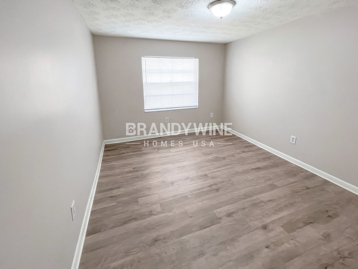 Building Photo - 8409 Red Holly Ln