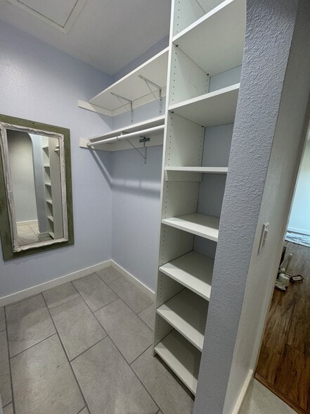 Master closet with mirror and built ins. - 22471 Loch Lomond Dr