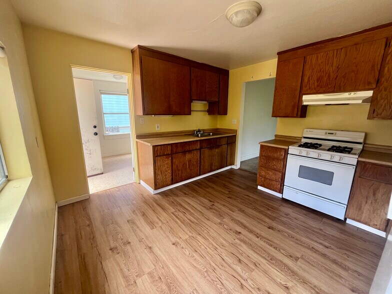 Kitchen with laundry room in background - 409 Washington Ave