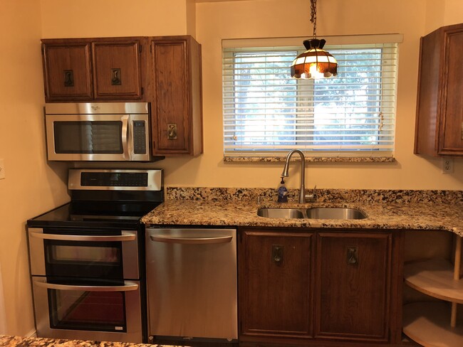 Kitchen with new SS appliances and granite countertops - 3805 jonesbridge road