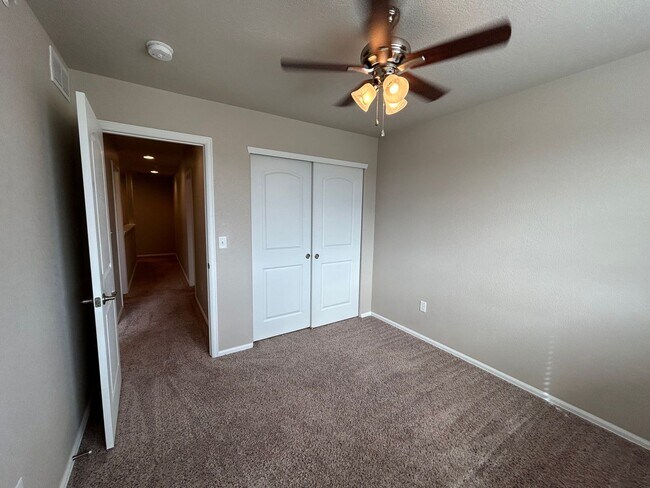 Building Photo - $500 Off First Month Of Rent! Modern 3BR Townhome with Fenced Yard & Garage
