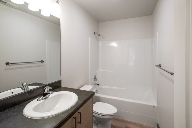 Building Photo - Pet Friendly! Gorgeous 3 Bedroom condo with double stall attached garages with AC.