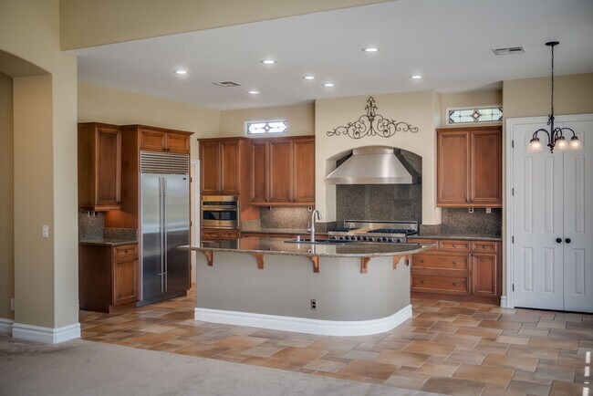 Entertain in this professional chefs kitchen with Sub-Zero and Viking adjacent to the great room. - 2850 Bronzino Ct