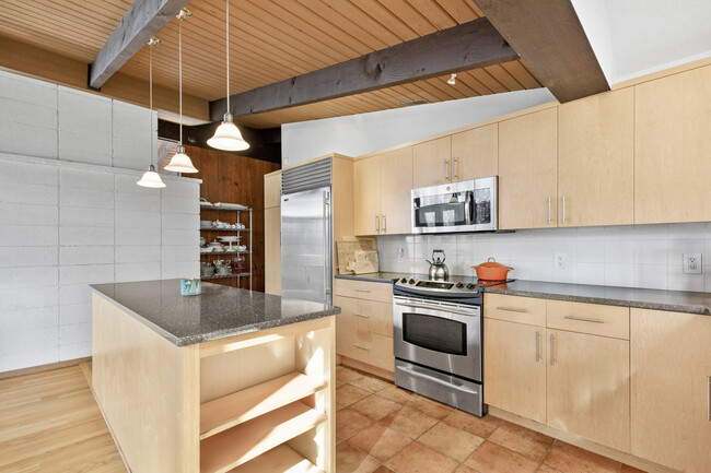 Kitchen featuring stainless steel appliances and granite countertops. - 19 Cottontail Ln