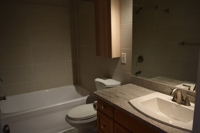 Building Photo - Updated 2-Bedroom Condo with Finished Basement, Garage, Pool, Tennis, Clubhouse