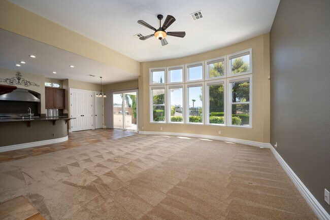 Convenient open floor plan integrates the kitchen and family room with incredible mountain views. - 2850 Bronzino Ct