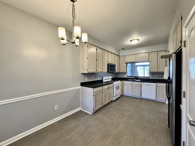 Building Photo - Ready NOW!! A 3-Bedroom Townhome w/Attache...