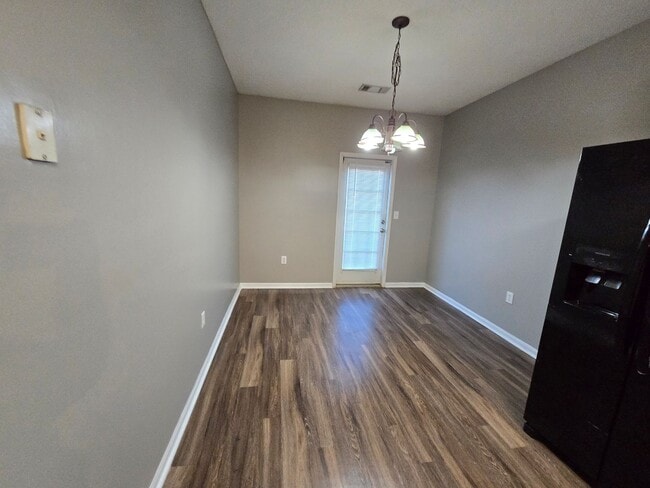 Building Photo - Rent INCLUDES water/sewer and yard maintenance.