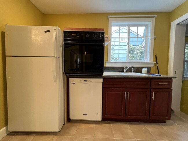 Building Photo - Classic Brick Portland Home on Stark Street with Dual Living Areas and Two Full Kitchens