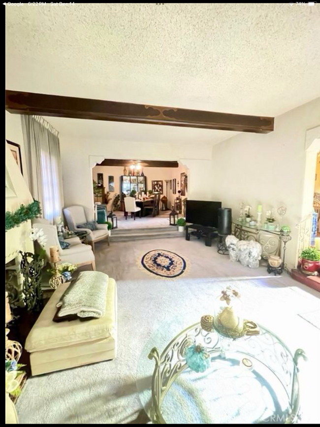 Living room and dining room before remodel - 802 S Detroit St