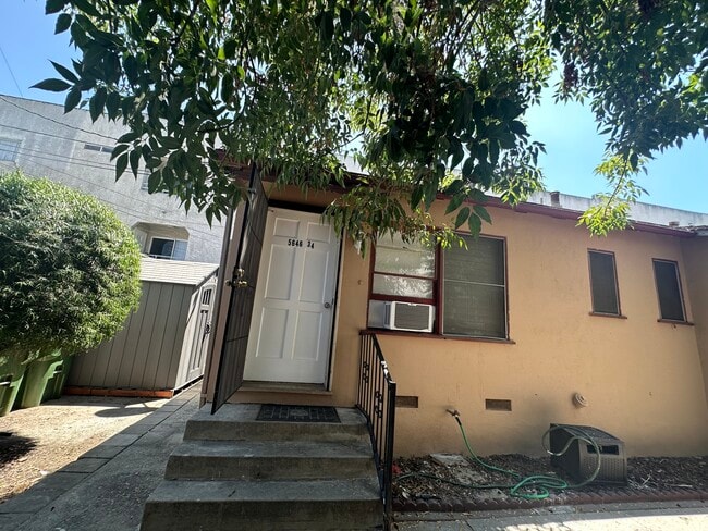 Front door includes a heavy-duty locking metal screen for extra protection and airflow - 5646 Farmdale Ave