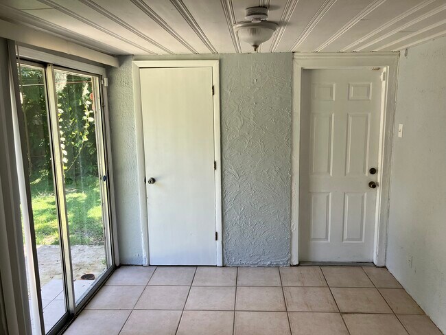 Doors to backyard patio, laundry room and carport from dining room - 1331 S Summerlin Ave