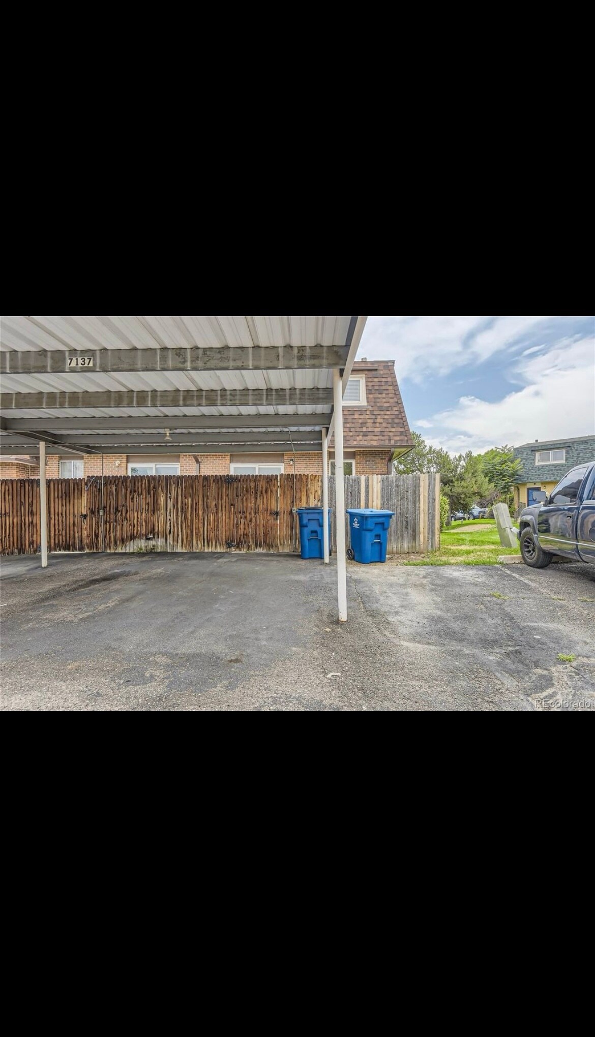 2 covered parking spots directly behind unit - 7137 S Webster St