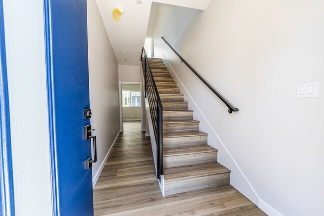 Building Photo - Contemporary 4-Bed, 4.5-Bath Townhome with...