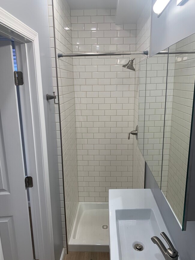 Bathroom next to bedroom 1 - view of shower - 4631 Massachusetts Ave NW