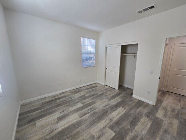 Building Photo - Open-Concept Living with Downstairs Bedroom & Enclosed Patio Retreat