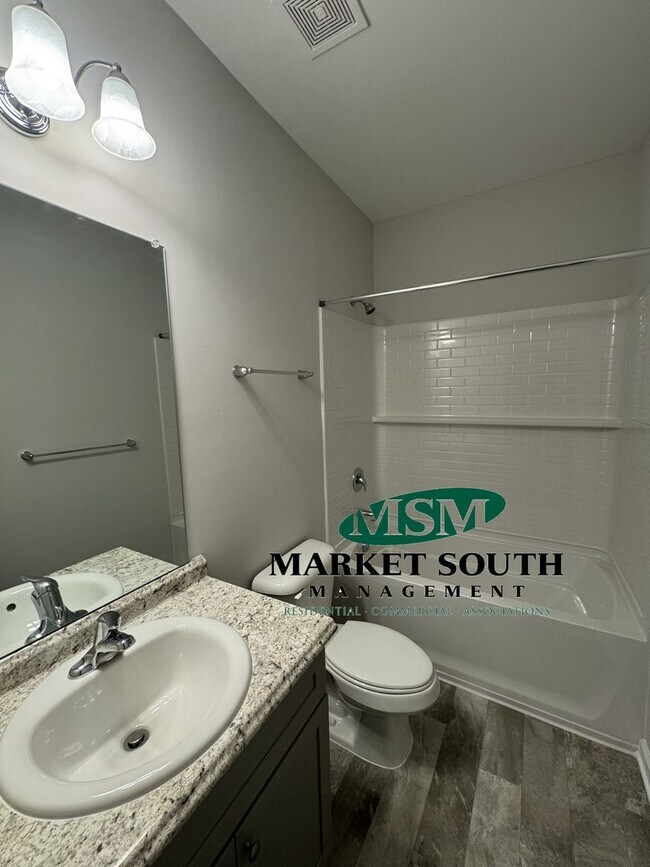 Building Photo - NEW CONSTRUCTION WITH PRIVACY FENCED YARD