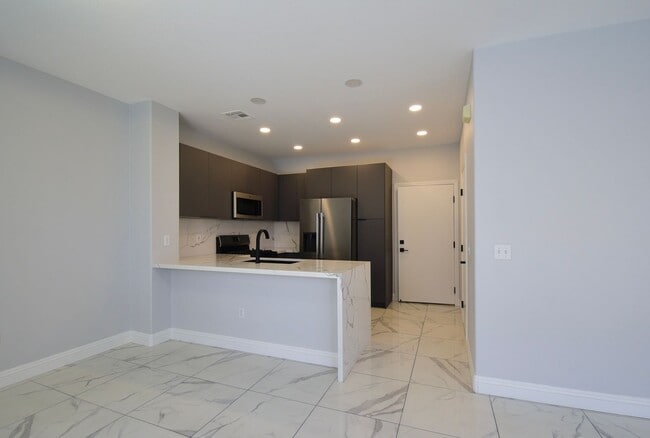 Building Photo - Charming Mediterranean-Style Townhome in G...