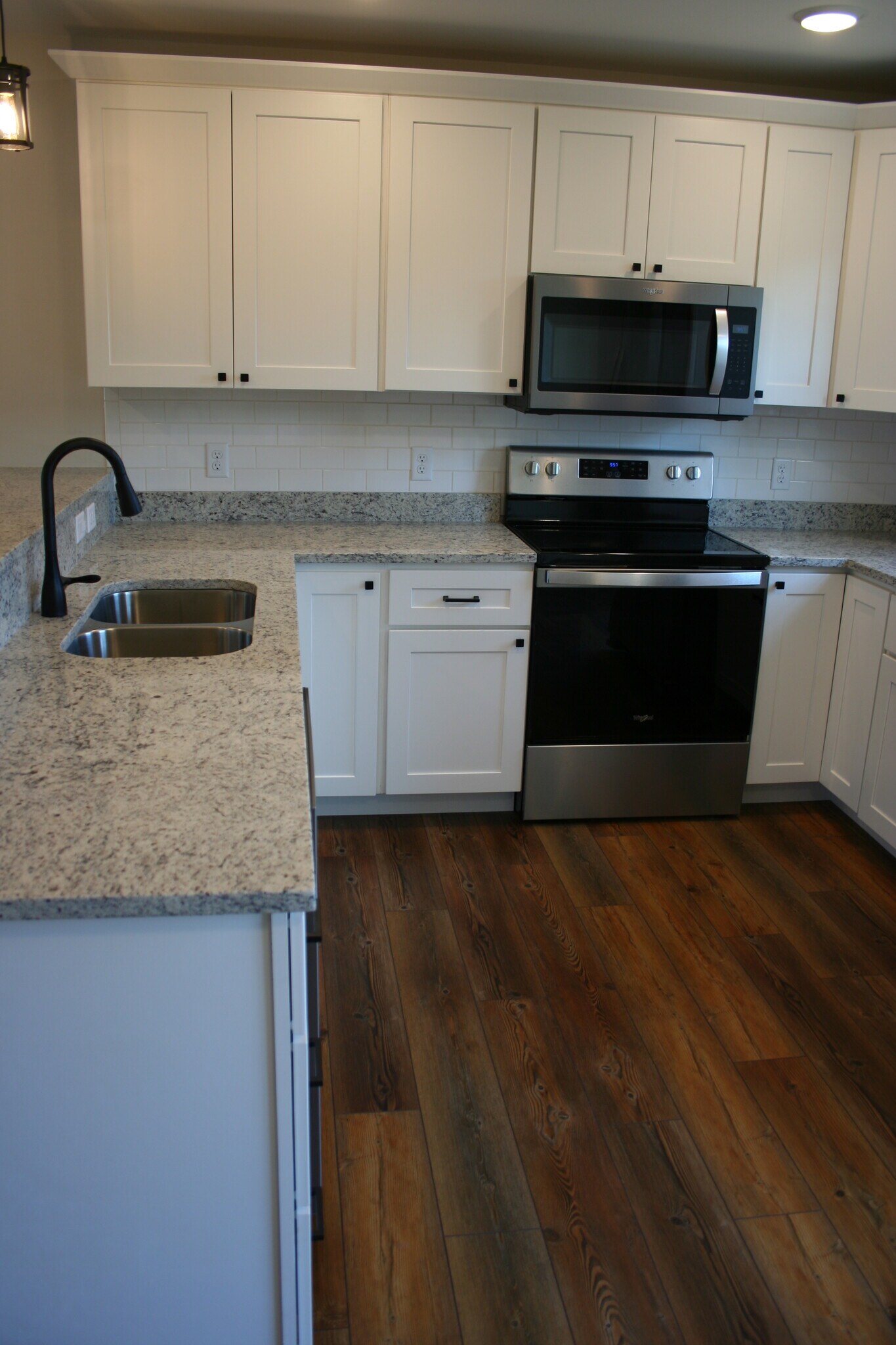 granite tops and crisp white cabinets - 2720 Dorval Rd