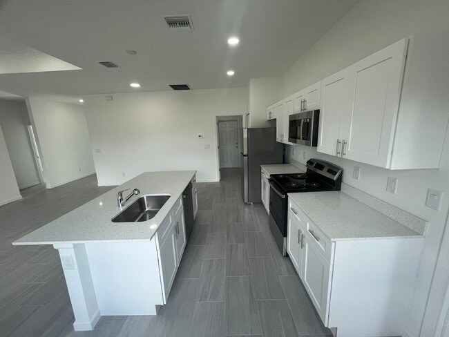 Building Photo - BRAND NEW CONSTRUCTION! GORGEOUS 4 BD/ 2BA HOME IN LEHIGH ACRES