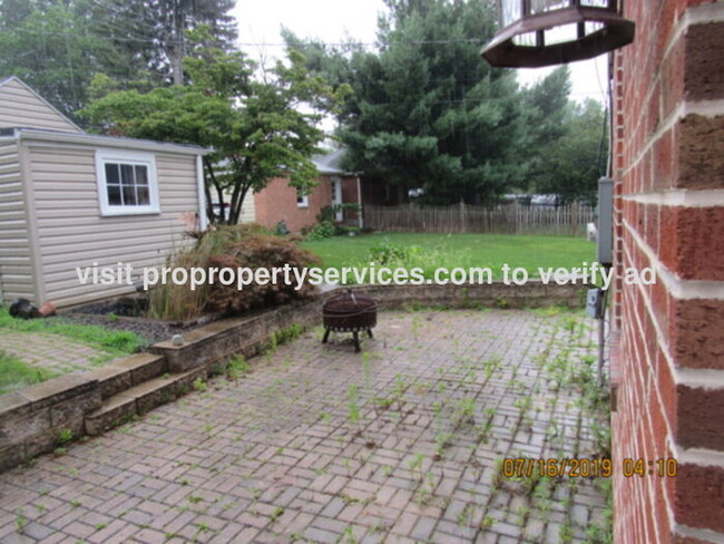 Building Photo - Charming Renovated Brick Cape Cod In Estab...