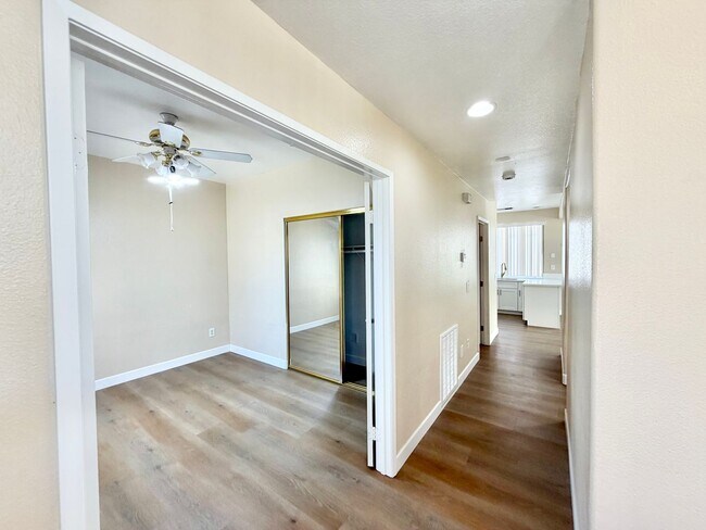 Building Photo - Spacious 5 Bedroom Home with 3 Car Garage & Primary Suite Balcony