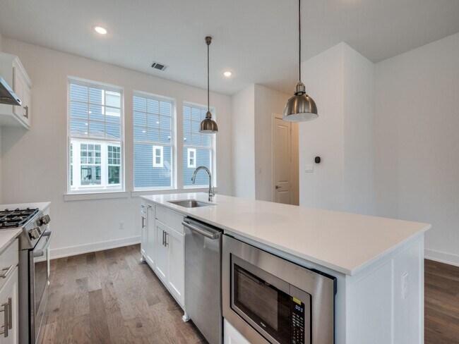 Building Photo - Welcome to a beautiful Craftsman-style end...