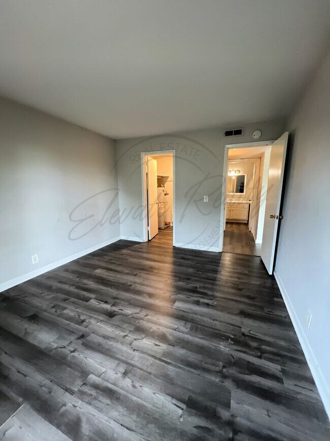 Building Photo - One Bedroom Condo, FIRST FLOOR, Assigned P...