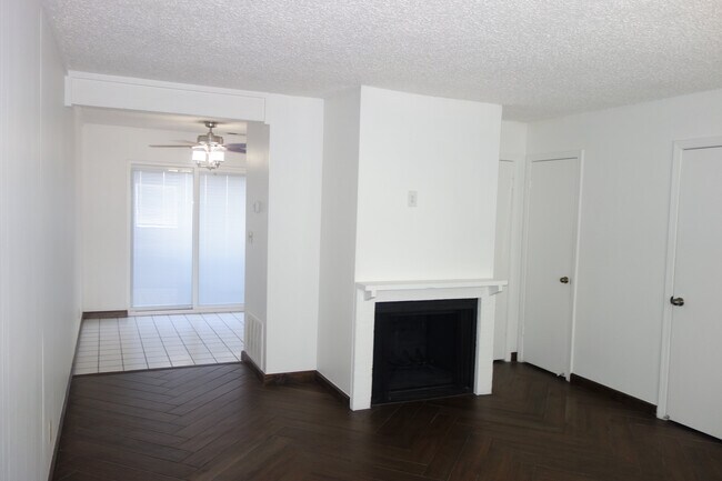 Living room view. Left leads to the kitchen. - 3421 E 35th St