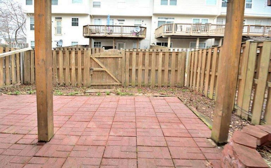 Private fenced in patio. - 14614 Stream Pond Dr