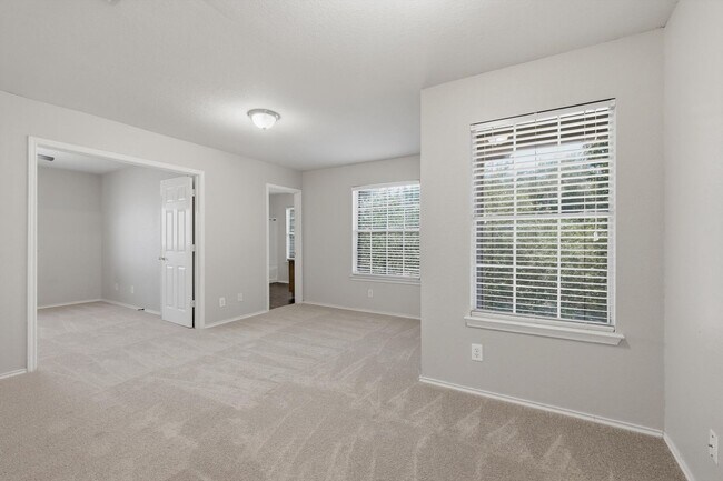Building Photo - 4BR Home with Open Living Area & Included Appliances