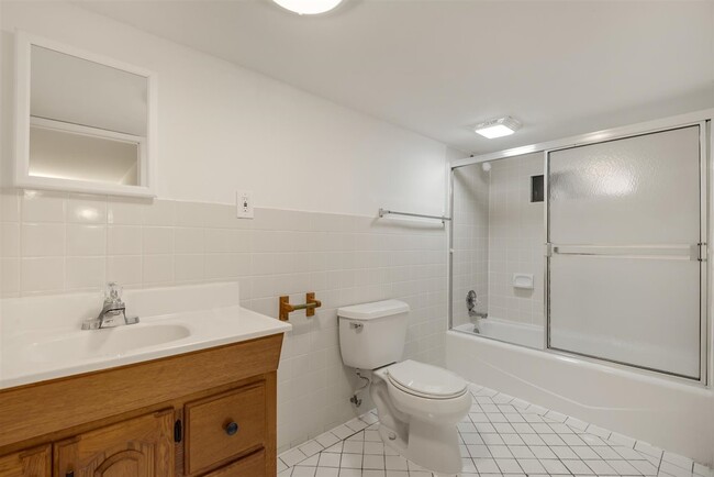Spacious and clean large bathroom with light/fan. - 2108 E 23rd St