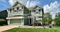 Building Photo - Updated Kitchen, Large Two Tiered Deck, Finished Basement in Blue Valley Schools!