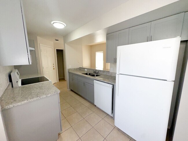 Building Photo - NEW-Remodeled bathroom & kitchen! NEW VINYL PLANK flooring & fresh paint! 2 bedroom 1 bath condo ...