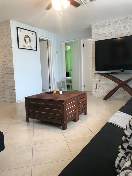 Living room with a view to private bedrooms and bathroom. - 2440 Manasota Beach Rd