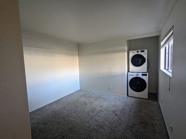 view of bedroom 2 and laundry nook - 4025 Via Diego