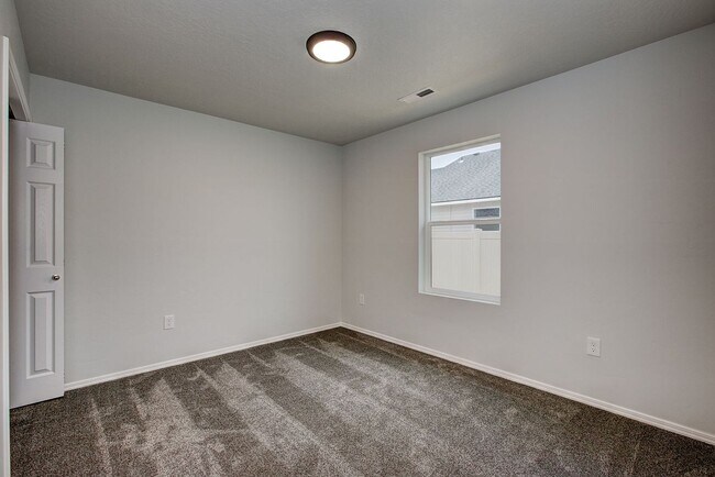 Building Photo - The 3 bedroom, 2 bedroom home also has a f...