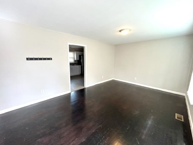 Building Photo - FOUR BEDROOM ONE AND HALF BATH BRICK RANCH HOME