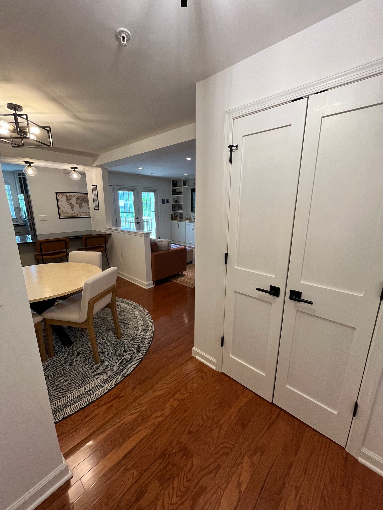 Entryway with plenty of storage. Updated black hardware on the doors. - 4079 S Four Mile Run Dr