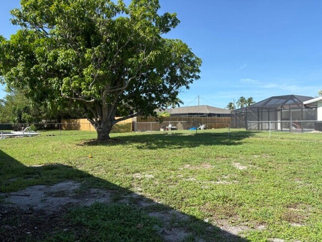 Building Photo - ****TWO WEEK FREE**** Charming 2-Bedroom Ranch in Cape Coral’s Bimini Basin Neighborhood