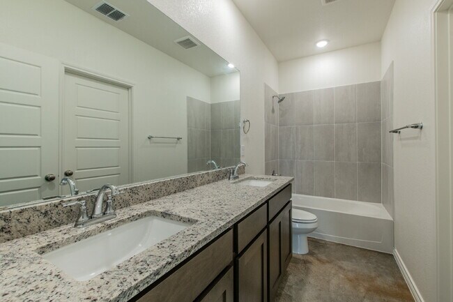 Building Photo - Brand New 3BR Duplex with Modern Concrete Floors & Fenced Yard!