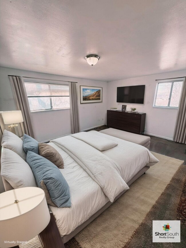 Building Photo - Updated - 2 bed 1.5 bath, Duplex with attached garage and fenced in backyard