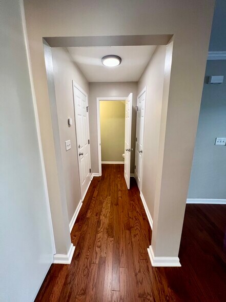 Hallway to Hall Bath, Garage, and Coat Closet - 3315 Weston St