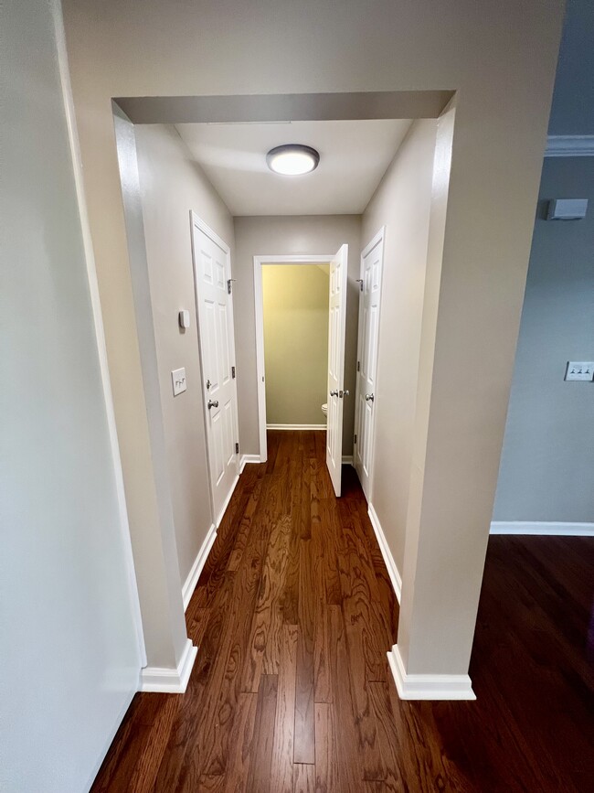 Hallway to Hall Bath, Garage, and Coat Closet - 3315 Weston St